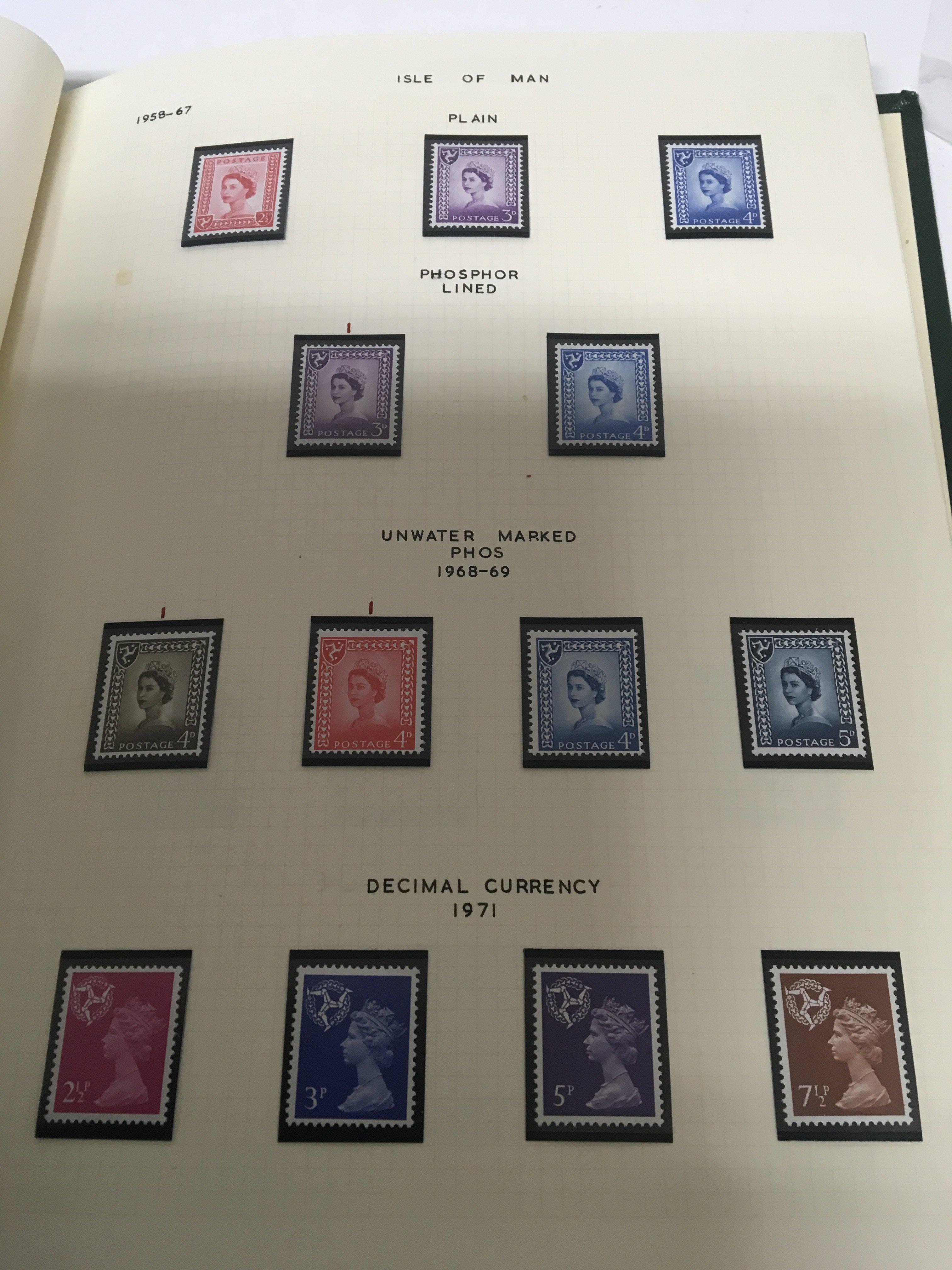 A collection of four stamp albums including QEII C