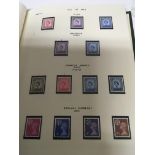 A collection of four stamp albums including QEII C