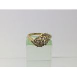 An 18ct gold diamond cluster ring, approx 3.8g and