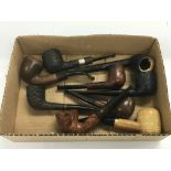 Nine smoker's pipes including one silver banded ex