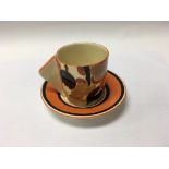 A Clarice Cliff coffee can decorated in orange chi