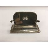 A silver desk calendar, approx 9.5cm wide and 6cm