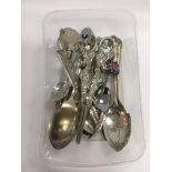 A small collection of silver plated cutlery, grape
