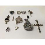 A collection of silver pendants and silver rings