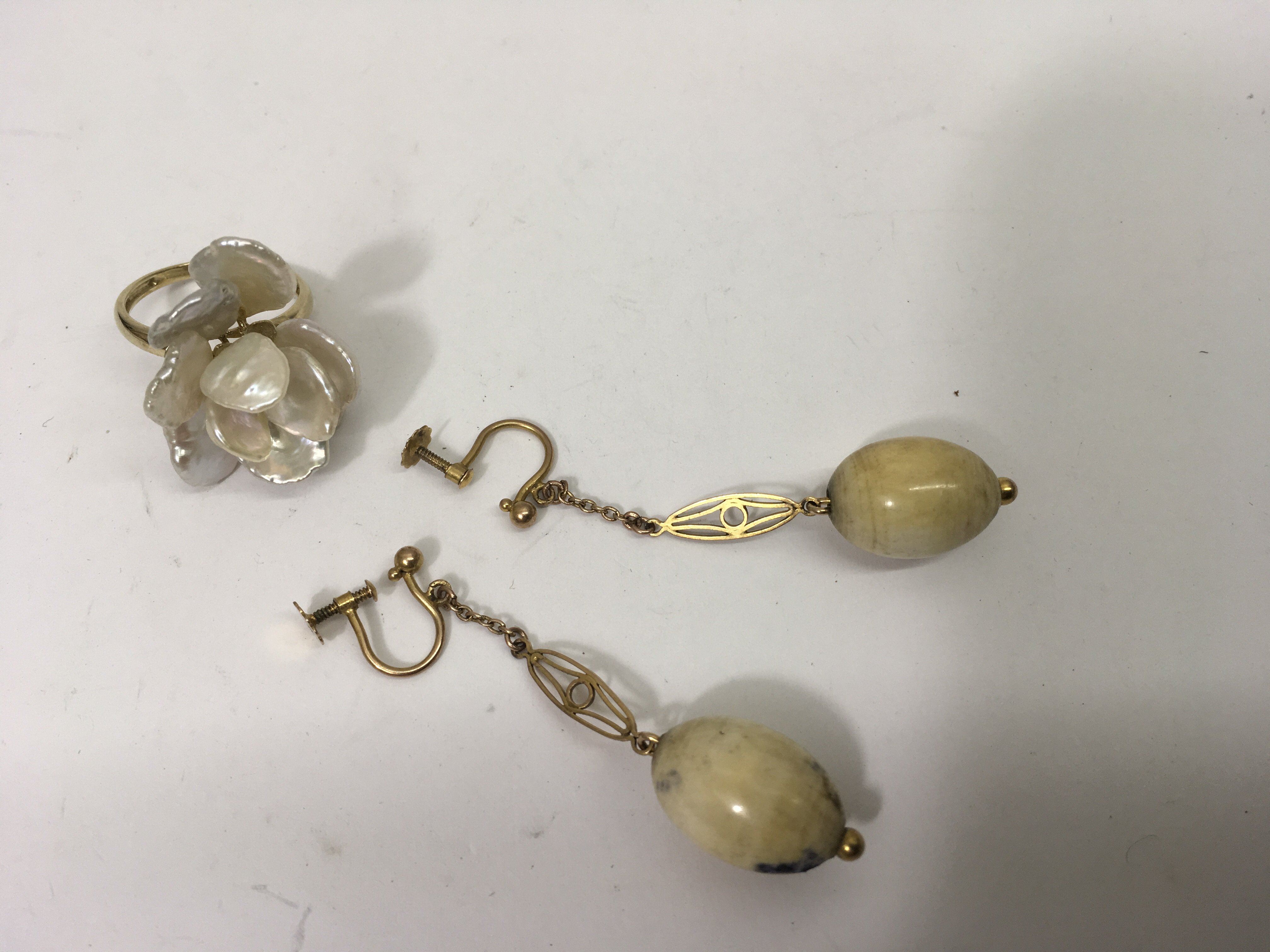 A pair of 1920's screwback drop earrings and a Mot