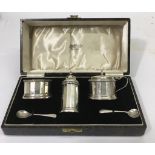 A cased, Birmingham silver condiment set of fluted
