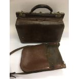 A vintage Gladstone bag and a leather money bag (2).