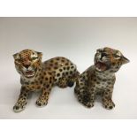 WITHDRAWN: Two ceramic figures of leopards, approx heights 22cm and 24cm.