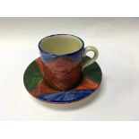 A Clarice Cliff coffee can and saucer decorated in
