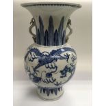 A blue and white vase decorated with dragons chasing a pearl, approx 30cm, a/f.
