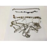 A collection of silver necklaces and bracelets