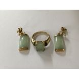 A pair of jade earrings with gold mounts and a gol