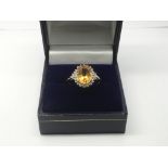 A 9ct gold, citrine and white topaz ring, approx 2