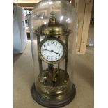 An anniversary clock under a glass dome, total app