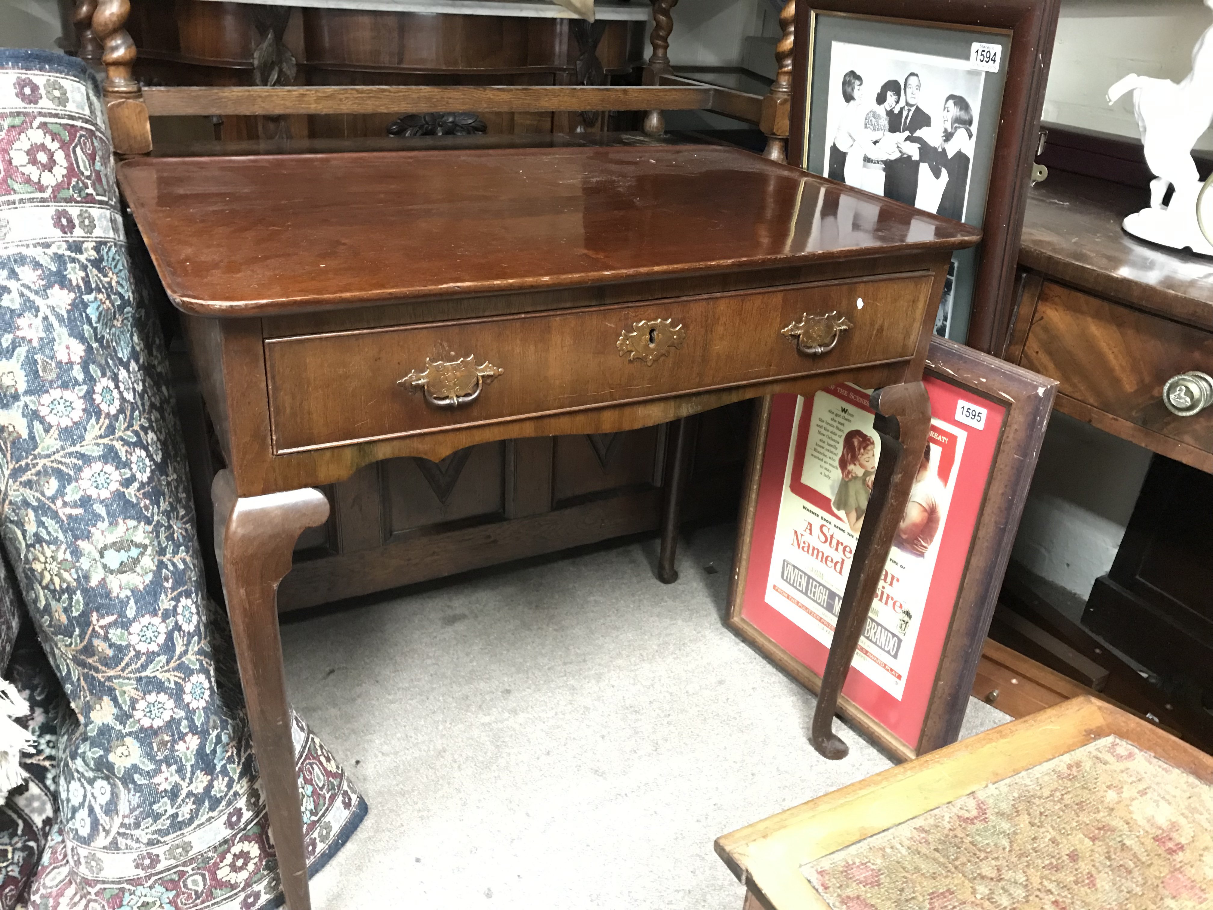 A Walnut George II Irish table with a single drawe