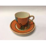 A Clarice Cliff coffee can with saucer decorated w