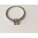A 9 ct white gold ring inset with a solitaire diamond size q