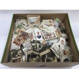A box of loose cigarette cards.