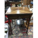 An inlaid Edwardian envelope card table, the taper