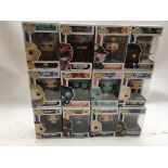 A box containing 12x Funko pop figures , boxed , i
