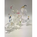 A collection of Swarovski birds including Flamingo