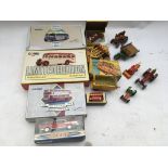 A collection of loose and boxed Diecast vehicles i