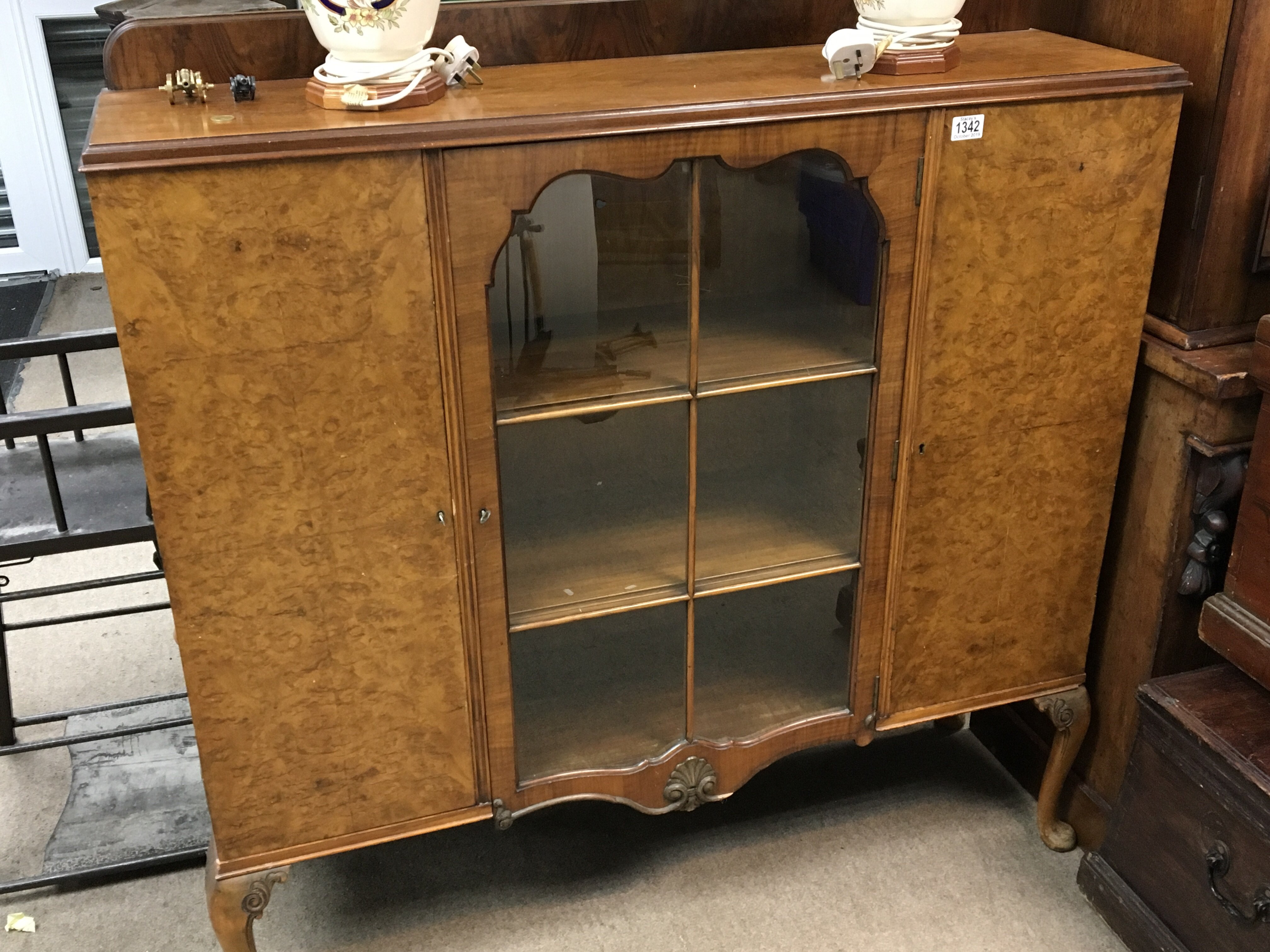 A walnut Display cabinet with a single glazed door