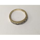 A 14 k gold ring inset with seven cz stones