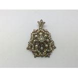 A silver gilt pendant encrusted with pearls, appro