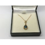 A 9ct gold, diamond and peacock kianite pendant on