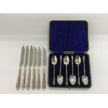 Six silver plated knives with the Cunard shipping