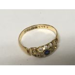 An 18carat gold ring set with two small diamonds a