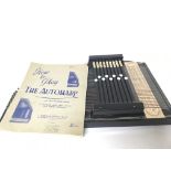 A Vintage Autoharp with a book of instructions.
