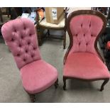 Two, low button back chairs with pink upholstery