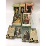 A box containing vintage tourist dolls including two by Peggy Nisbet