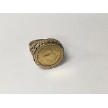 A 9 ct gold ring inset with 1/ 10 krugerrand 6.2 g