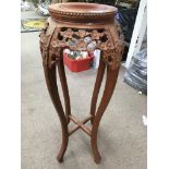 An oriental style wooden plant stand