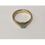 A 18 ct gold ring insetvwith a single diamond size N