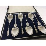 A cased set of Quality Victorian silver apostle spoons with shaped stems maker Henry Holland