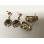 Two pairs of gold earrings set with coloured stone
