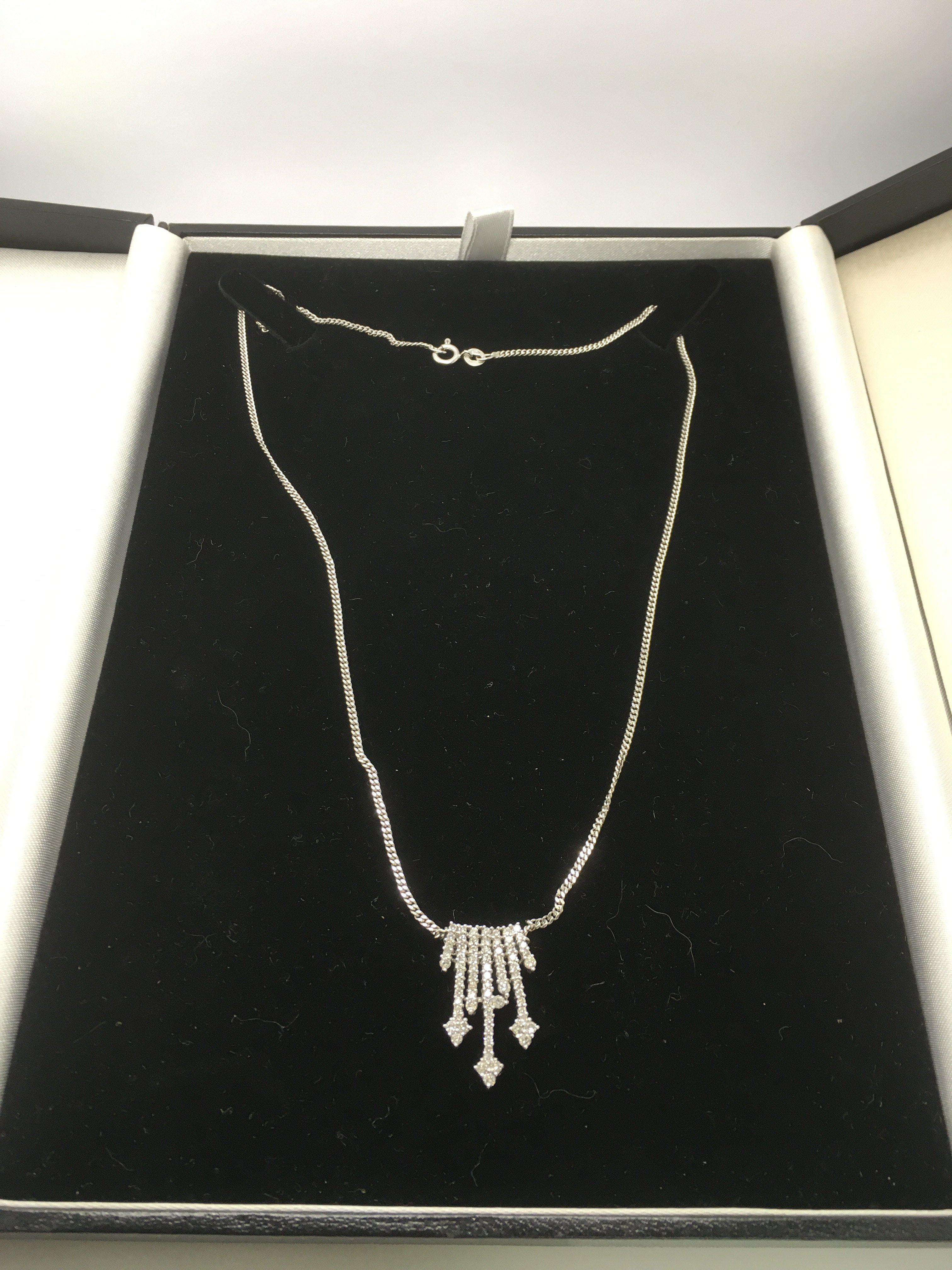 A 14ct white gold diamond necklace on a 9ct white