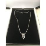 A 14ct white gold diamond necklace on a 9ct white