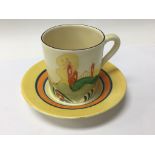A Clarice Cliff coffee can and saucer alpine style
