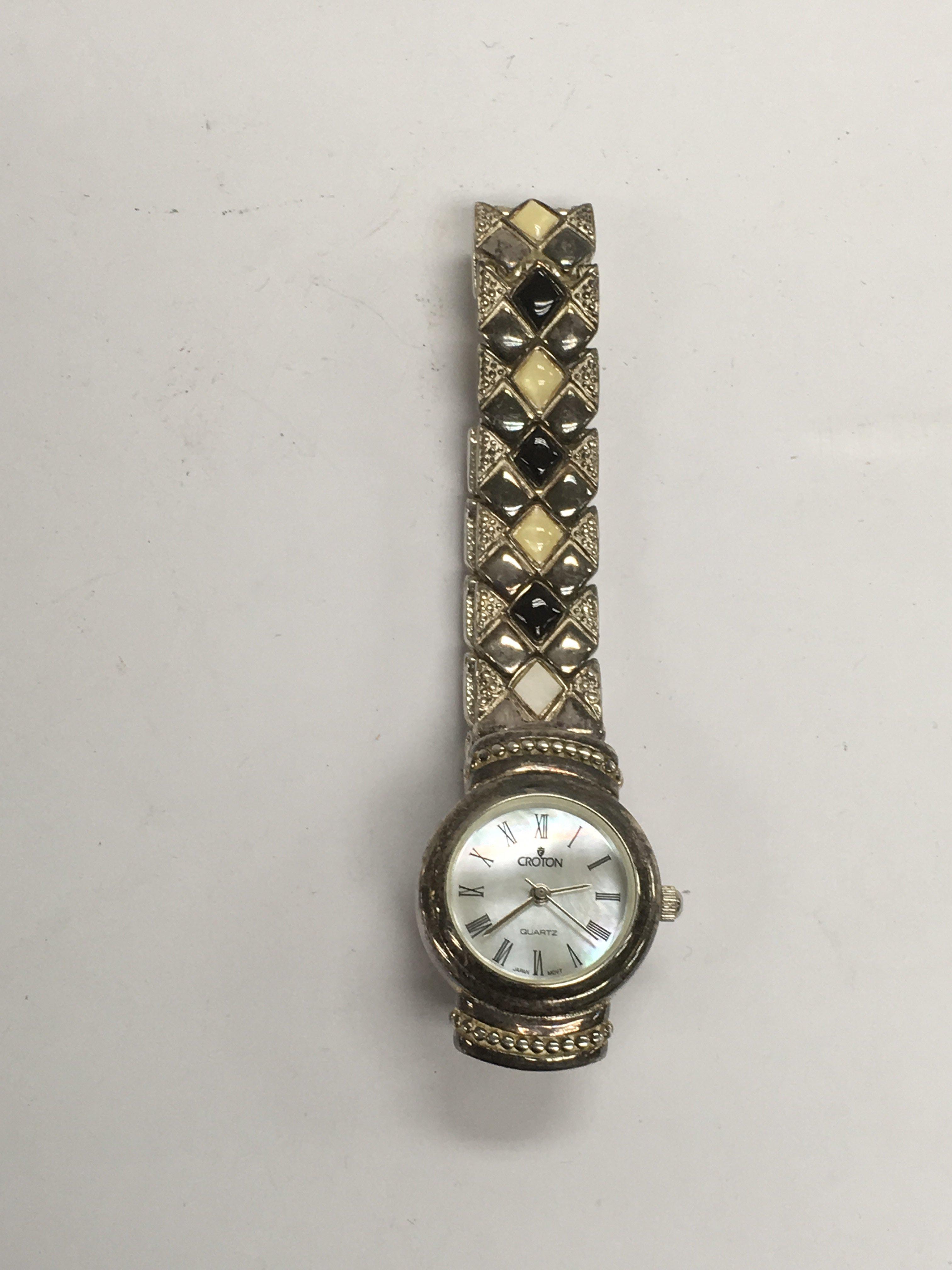 A Croton quartz ladies watch with a silver case an