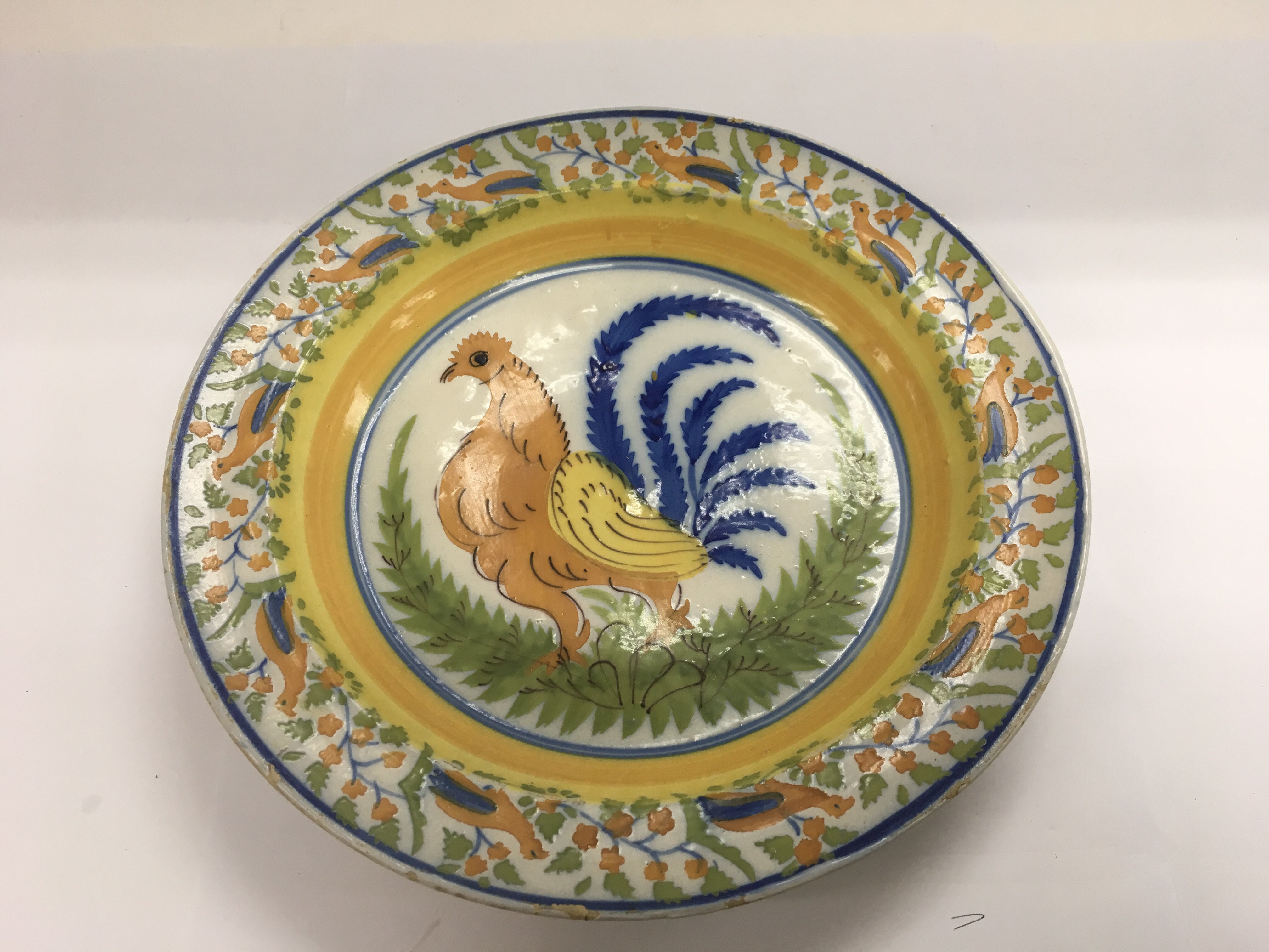 A French glazed dish with a handpainted cockerel t