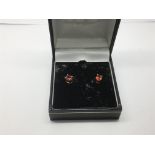 A pair of 9ct gold and ruby ear studs, approx 1.1g