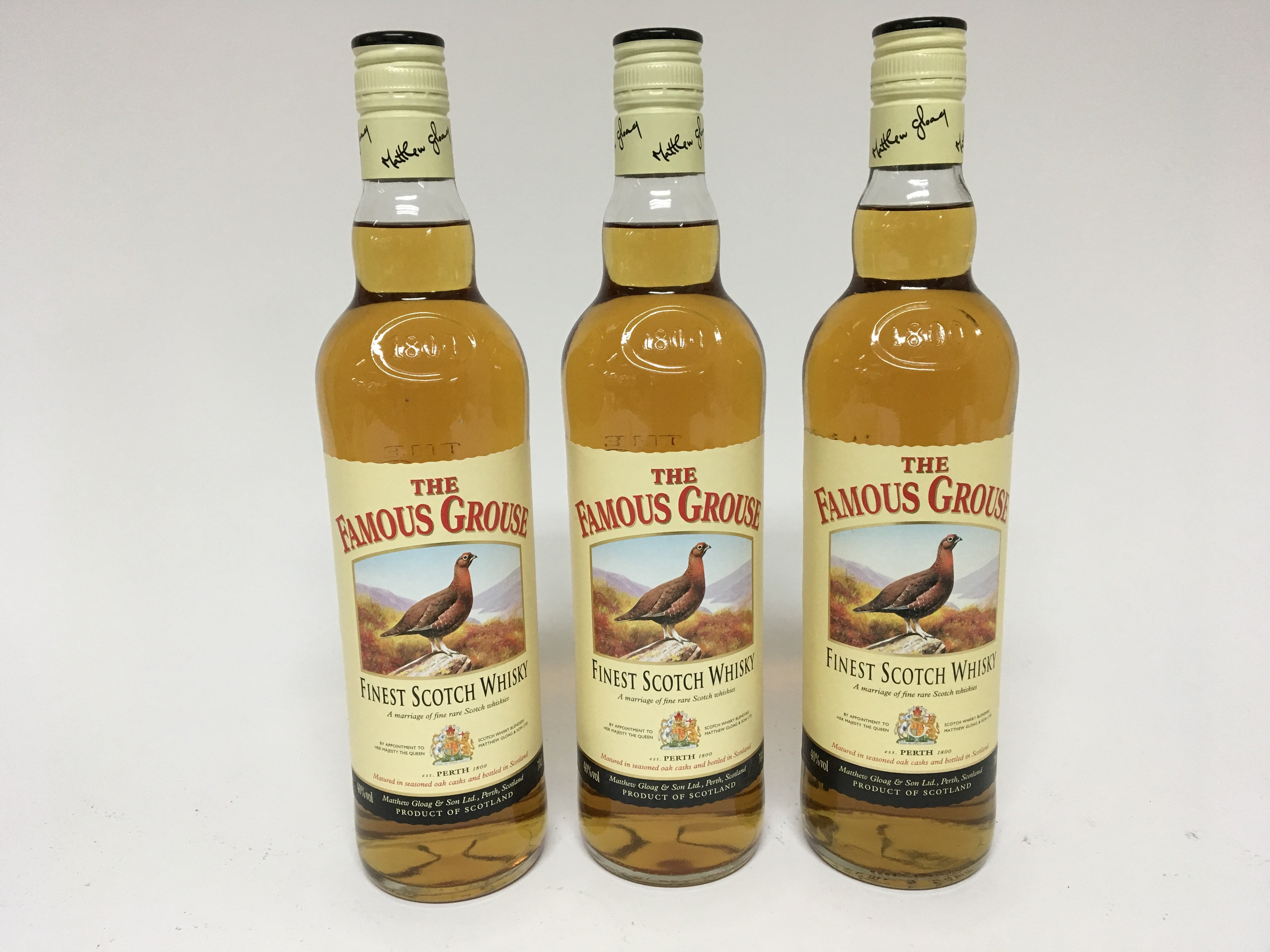 Three bottles of The Famous Grouse Finest Scotch W