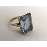 A 9ct gold ring set with a square aquamarine type