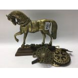 A Victorian brass and iron horse doorstop and five Victorian horse brasses
