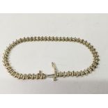 A 14k gold and diamond set line bracelet .Approx 2